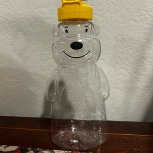 Clear reusable honey bottle with yellow cap